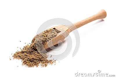 Close-up of pile of ground cumin spice in a wooden spoon on whit Stock Photo