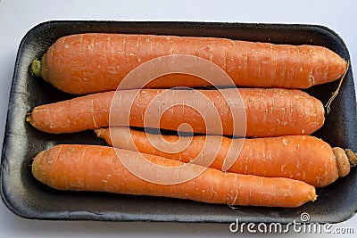 Close-up of a pile of orange carrots in a market Stock Photo