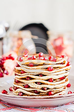 Close up of a pile of pancakes with pomegranate seeds Stock Photo