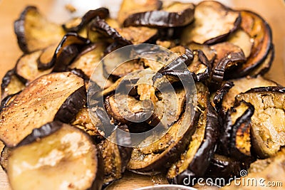 Close up of pile of slices of roasted cooked spicy eggplant Stock Photo