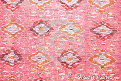 Close up pink silk handicraft,Fabric fashion design,Beautiful Thai style fabric pattern background ,Texture of Thai cloth Stock Photo