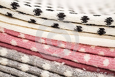 Close up of Pink, White and Gray Pair of Child Socks on White Ba Stock Photo