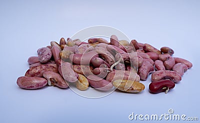 A close-up of pinkish beans showing initial sprouting and color variations. Pile of pinkish beans with some displaying the first Stock Photo