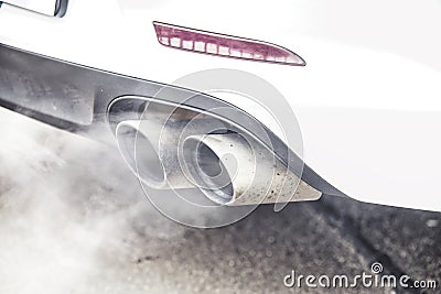 Close up on pipe exhaust car smoke emission Stock Photo