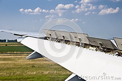 Close up on plane wing spoiler Stock Photo