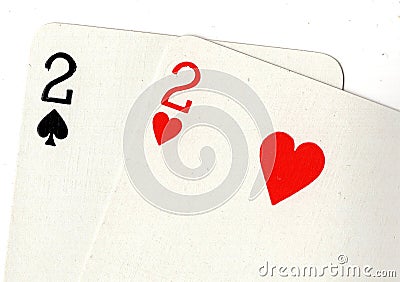 Close up of playing cards showing a pair of twos. Stock Photo