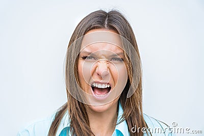 Close up portrait of angry mad woman face. Female screaming or shouting. Concerned and stressed woman Stock Photo