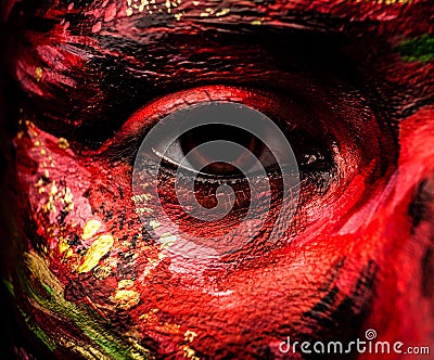 Close-up portrait of an artistic woman painted with red & green color. Stock Photo