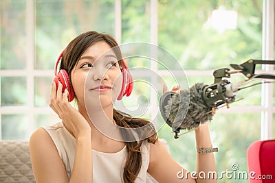 Close up-portrait asian women trendy blogger of beautiful,attractive and charming,singing with microphone,tutorial live broadcast Stock Photo