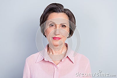 Close-up portrait of attractive content skilled woman wearing pink pastel shirt isolated over gray color background Stock Photo