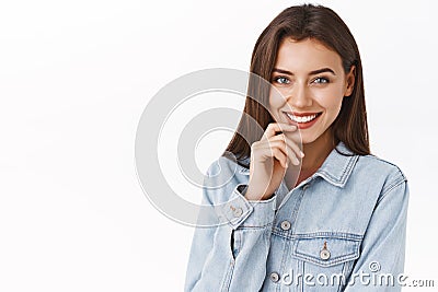 Close-up portrait attractive sensual, feminine woman with lovely smile, touching lip and giggle coquettish as standing Stock Photo