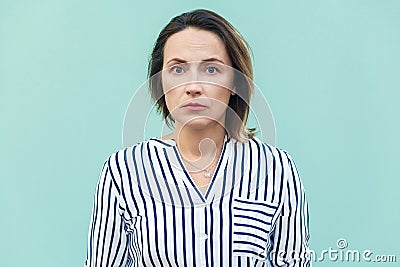 Close up, portrait bad mood business woman. Unhappy business woman looking at camera with tired face. Stock Photo