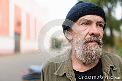 Close up portrait of beardy old man outdoors. Stock Photo
