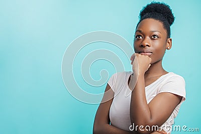 Beautiful African American woman looking up with distrustful look Stock Photo