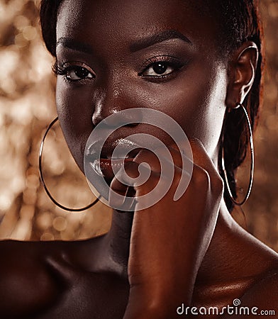 Close up portrait of beautiful african woman with creative gold make up Stock Photo