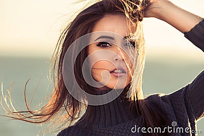 Close-up portrait of beautiful brunette woman outdoors Stock Photo