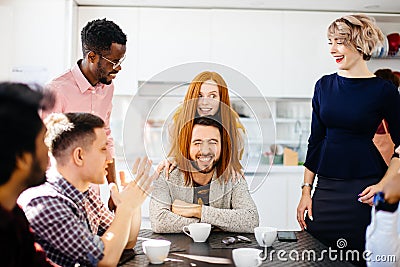 Beautiful ginger woman covering the man`s head by her long straight hair Stock Photo