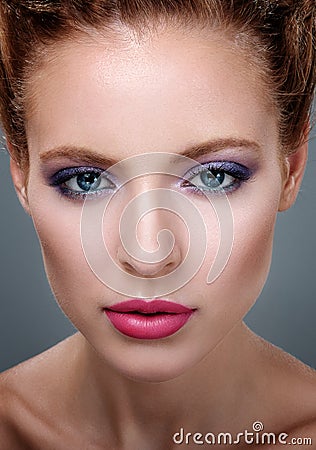 Close-up portrait of beautiful girl with bright makeup. Stock Photo