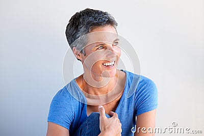 Close up beautiful older woman smiling and looking away Stock Photo