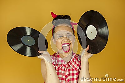 Close up portrait beautiful pin up girl with old vinil records Stock Photo