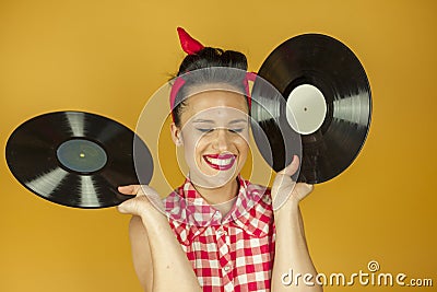 Close up portrait beautiful pin up girl with old vinil records Stock Photo