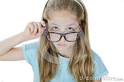 Close-up portrait of beautiful serious focused blond girl wearing glasses holding frame and looking at camera Stock Photo
