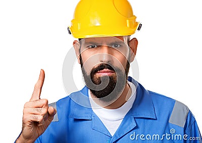 Close up portrait of bearded builder in hard hat, foreman or repairman in the helmet showing finger up, isolated Stock Photo