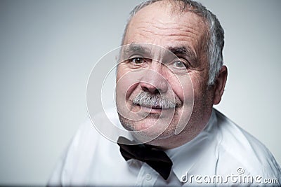 Close-up portrait of a Caucasian senior man with mustache Stock Photo