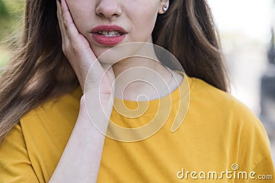 Close up portrait of a caucasian teen girl who has a toothache. Healthcare. Medicine. Stock Photo