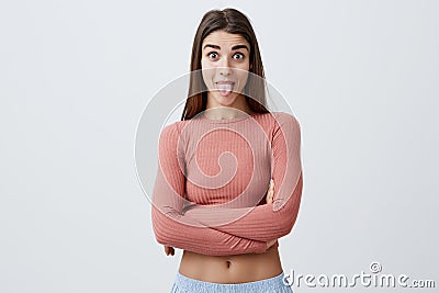 Close up portrait of charming good-looking joyful caucasian woman with long dark har in casual stylish clothes crossing Stock Photo