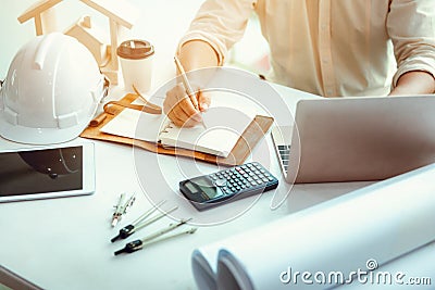 Close up portrait of civil engineer taking note construction planning report, Engineering and construction concept Stock Photo