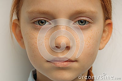 Close-up portrait of confident red haired girl isolated Stock Photo