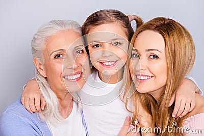 Close up portrait of cute nice friendly lovely adorable beautiful with toothy beaming smile embracing family isolated on gray Stock Photo