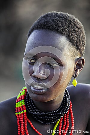 Close up Portrait of Dassanech Tribe Woman with Traditional Bright Necklace and Hairstyle Editorial Stock Photo