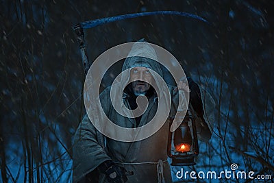 Close-up portrait of death with a scythe. Stock Photo