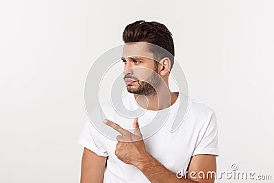 Close up portrait of disappointed stressed bearded young man in shirt over white background. Stock Photo