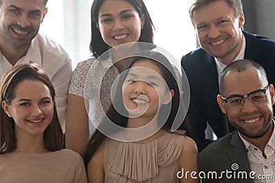 Close up portrait of diverse colleagues smile look at camera Stock Photo