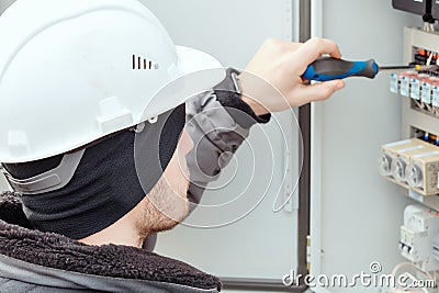 Close-up portrait of energy engineer in hard hat at work. Stock Photo