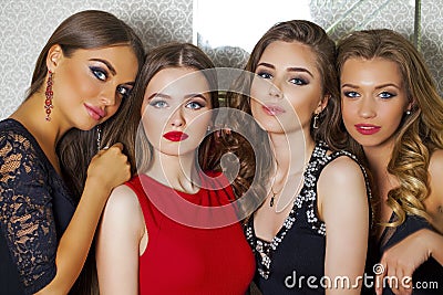 Close up portrait of four beautiful glamorous models in studio Stock Photo