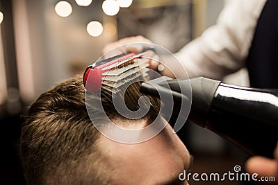 Hairdresser styling customer hair Stock Photo