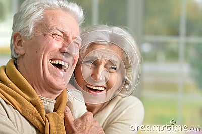 Portrait of a happy laughing senior couple at home Stock Photo