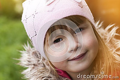 Close-up portrait of happy smiling pretty little girl. Soft light effect Stock Photo
