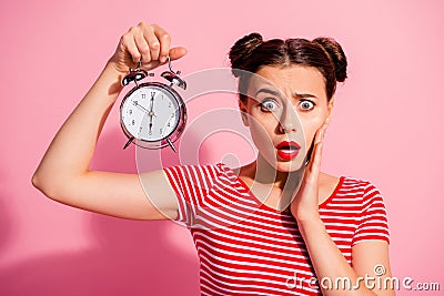 Close-up portrait of her she nice cute charming winsome lovely attractive worried girl wearing striped t-shirt holding Stock Photo