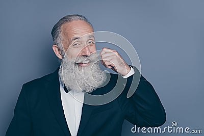 Close-up portrait of his he nice attractive content glad positive cheerful cheery gray-haired man touching fixing Stock Photo