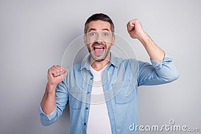 Close-up portrait of his he nice attractive successful cheerful cheery energetic motivated guy celebrating winning Stock Photo