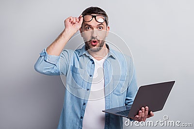 Close-up portrait of his he nice attractive wondered shocked stunned successful gray-haired guy it geek using laptop Stock Photo