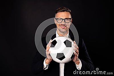 Close-up portrait of his he nice-looking attractive content cheerful cheery professional director holding in hands ball Stock Photo