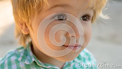 Close up portrait. Human child. Cute person. Big kids eyes. Beautiful child face. Stock Photo