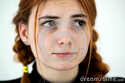 Close up portrait of innocent looking redhead pretty teenage girl Stock Photo