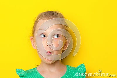 Close-up portrait of a little amazing girl with blue eyes and opening mouth Stock Photo